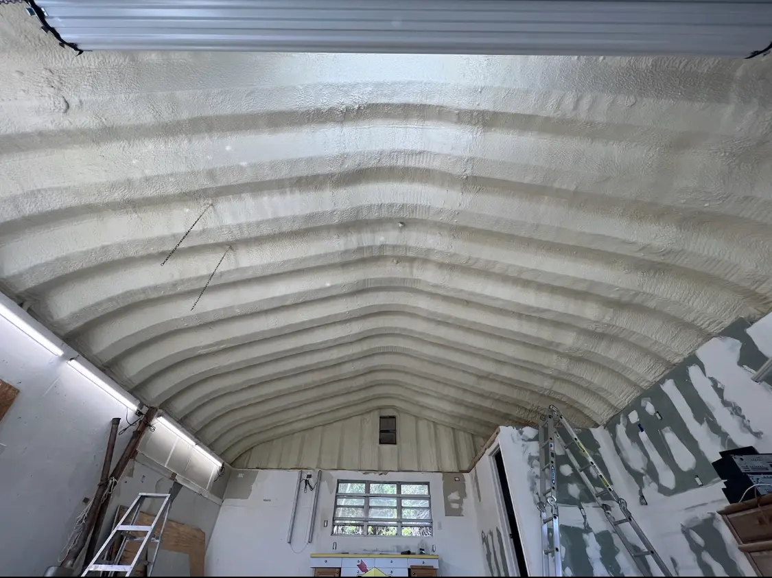 Spray polyurethane foam applied to the underside of a metal roof deck in Roanoke